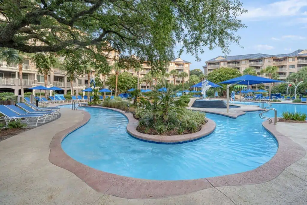 Lazy river pool and palm trees
