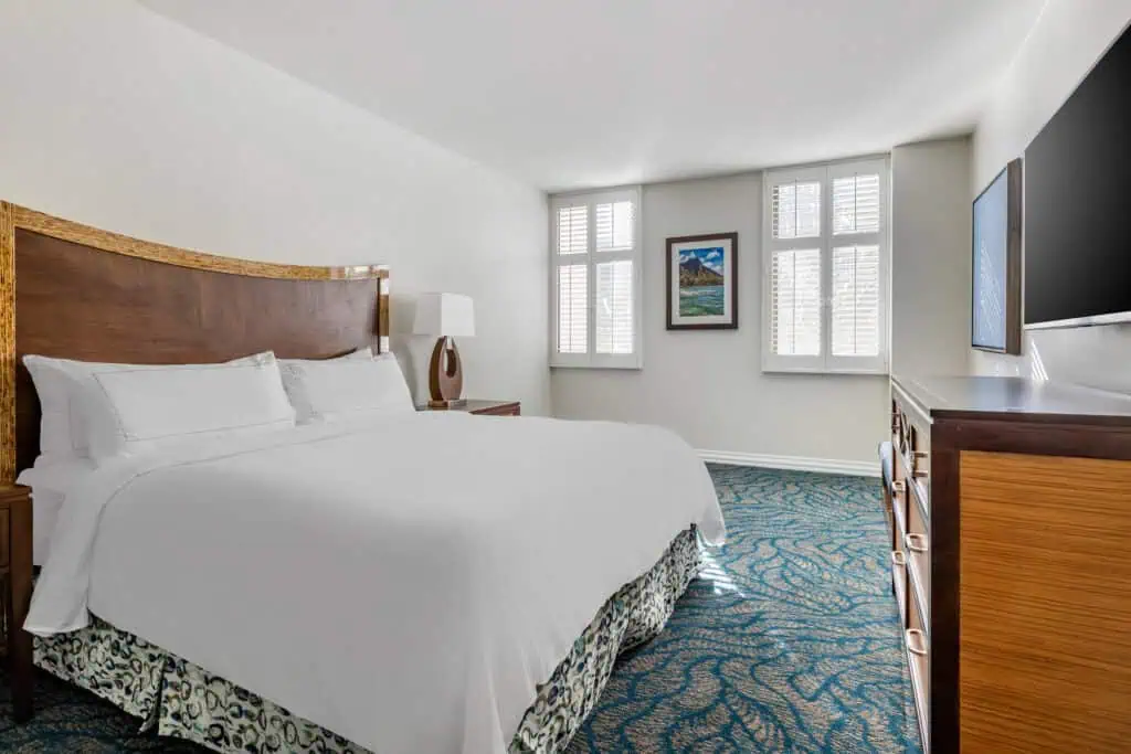 Primary bedroom with a king bed in a Lagoon Tower two-bedroom suite