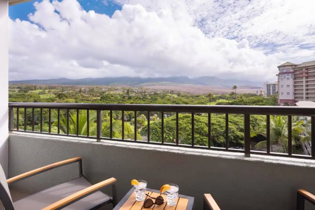 Balcony with view of garden, resort grounds