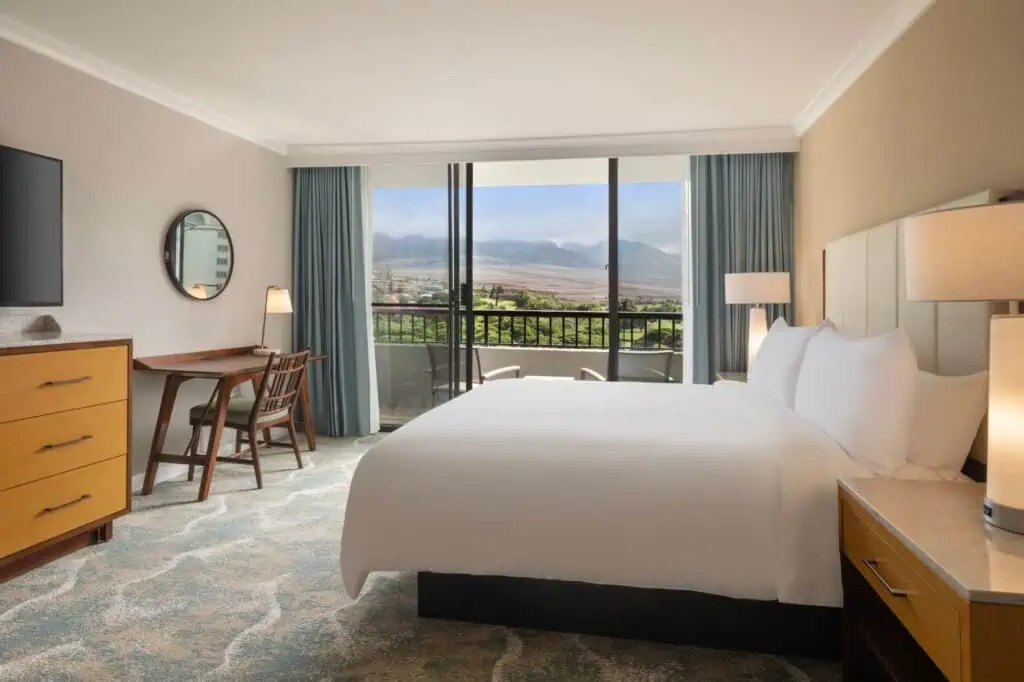 King bed, TV, desk, furnished balcony