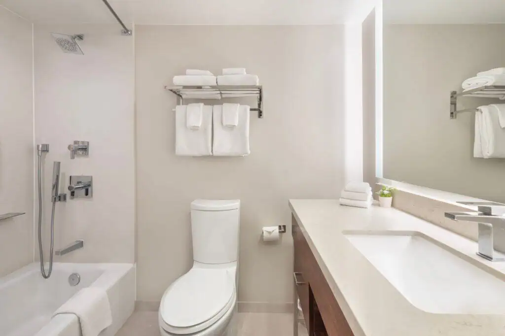 Single vanity, shower tub combination, towels