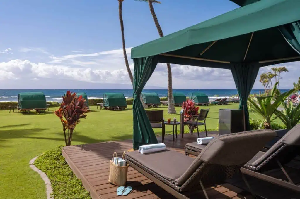 Beachside cabana with seating area, towels