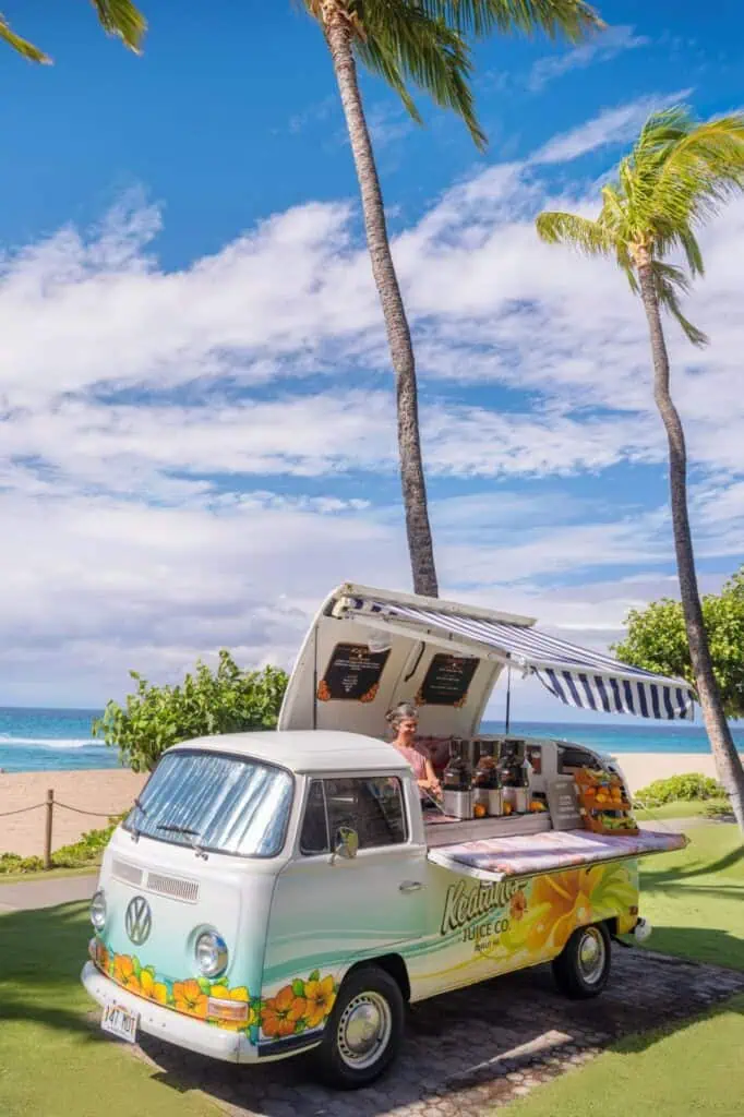 Converted vehicle van as juice stand near beach
