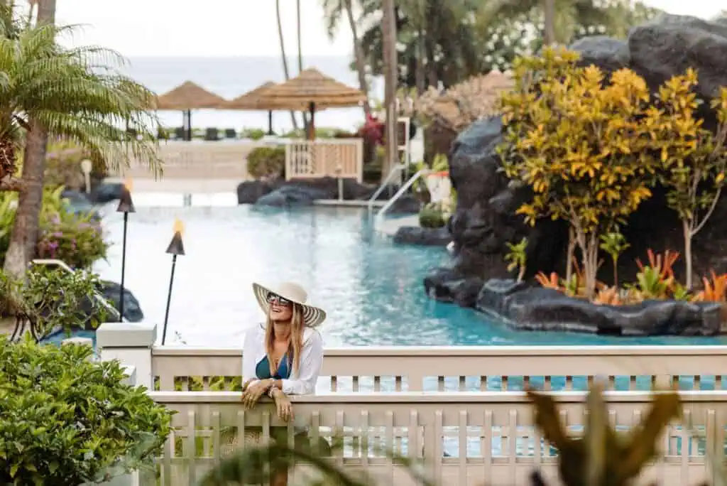 Woman standing on pool bridge