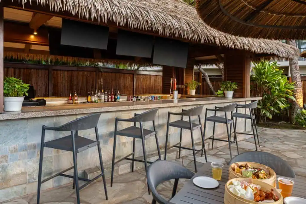Outdoor bar, dining tables with food, drinks