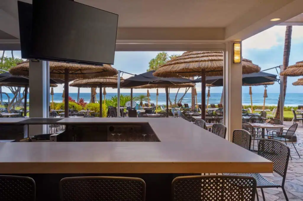 Outdoor bar, dining tables, view of beach
