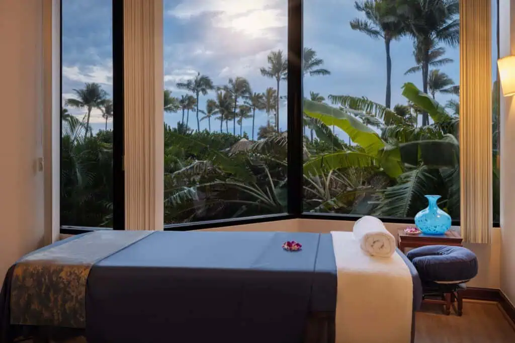 Massage table with view of palm trees