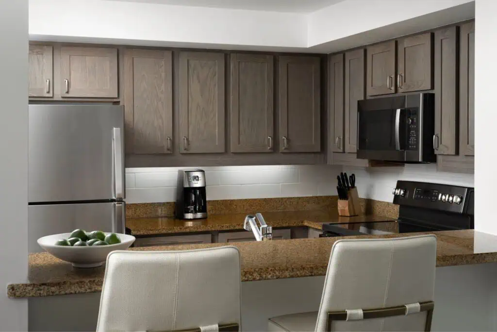 Kitchen with fridge, microwave, oven, coffee maker