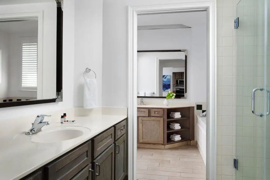 Sink, glass shower stall and tub