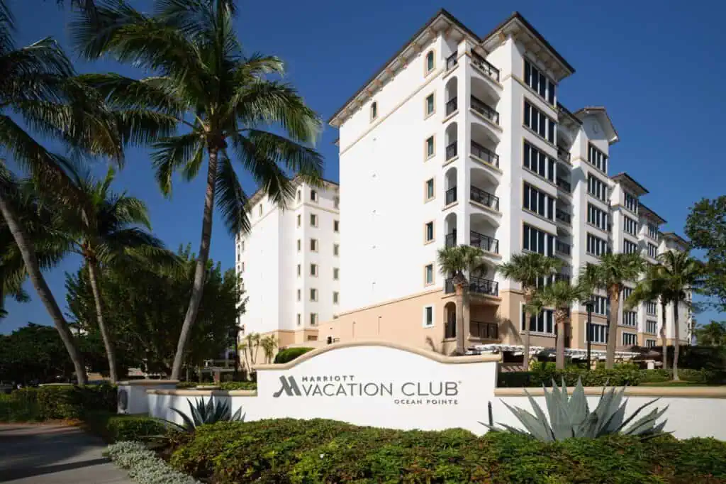 Exterior resort sign in front of villa building